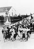 Immigrants disembarking at Angel Island