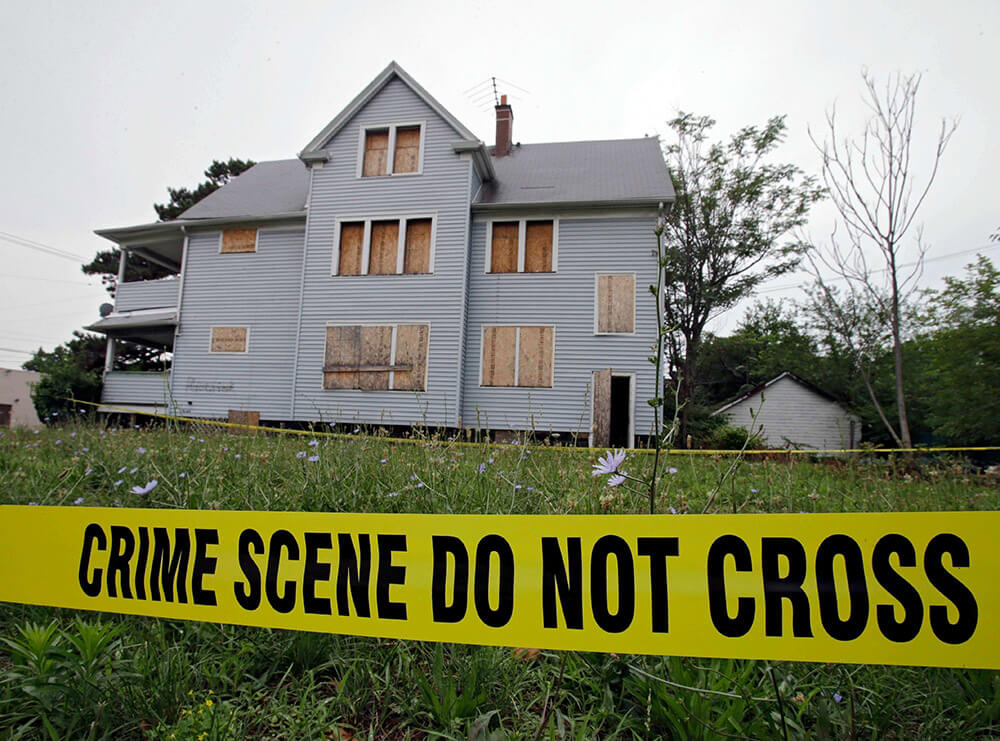 crime tape marks the scene of multiple homicides