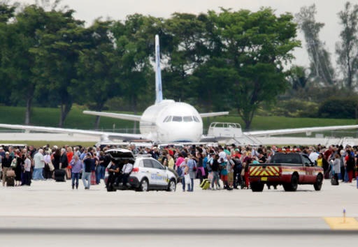 Image of people on tarmac at Ft. Lauderdale airport