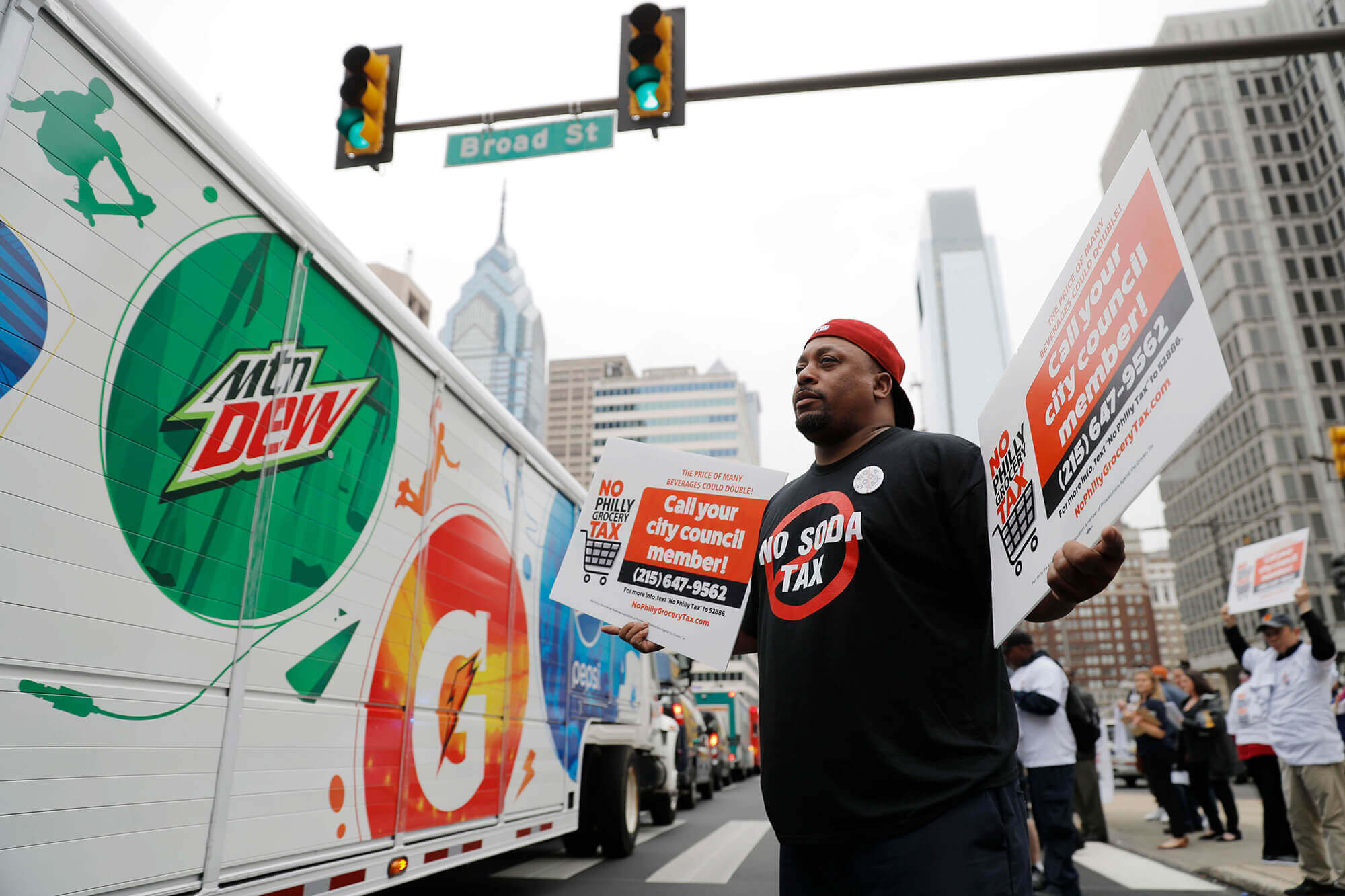 Image of man outside of Philadelphia city hall protesting the soda tax.