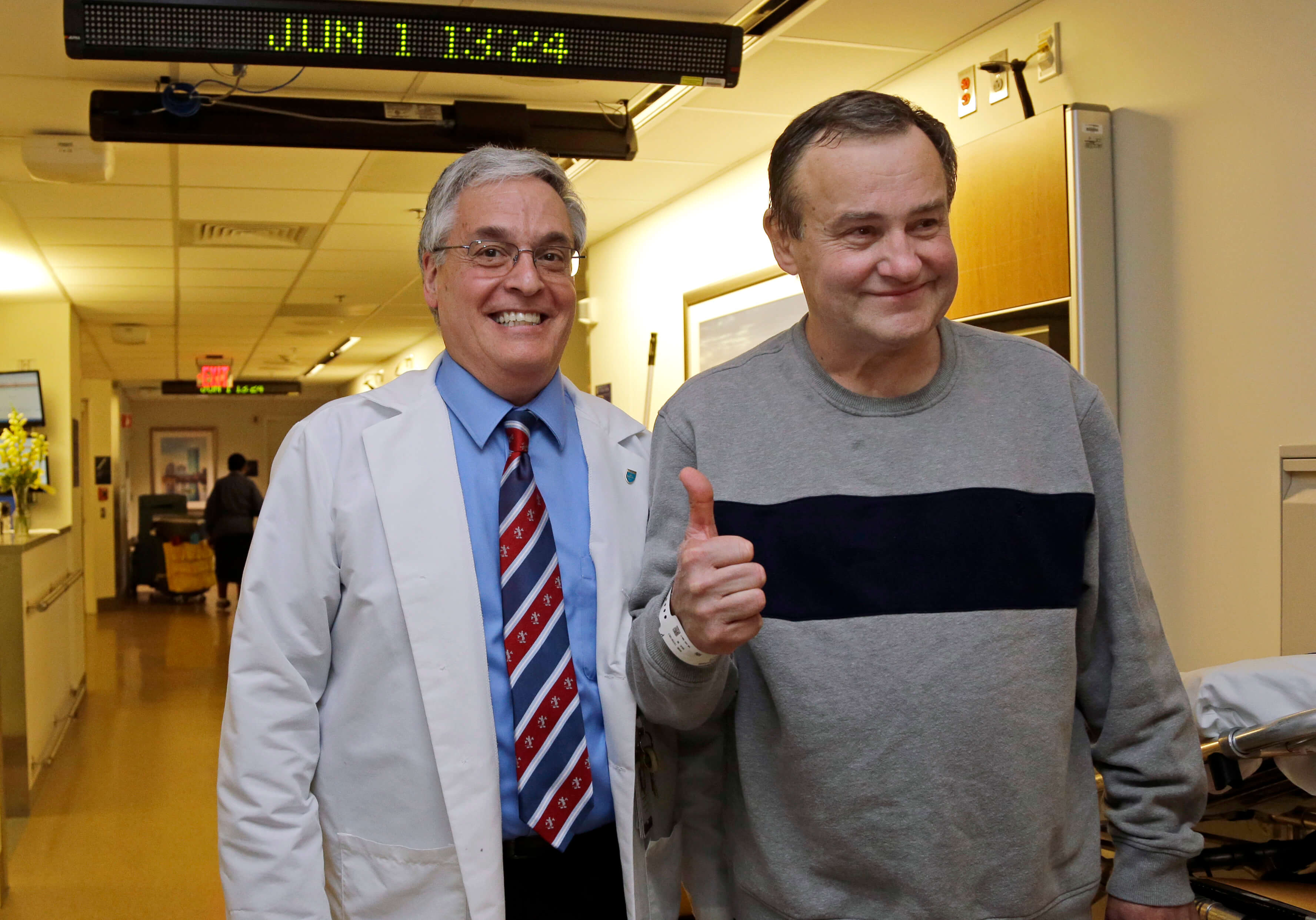 Image of Thomas Manning with a doctor as he is discharged from Mass. General Hospital