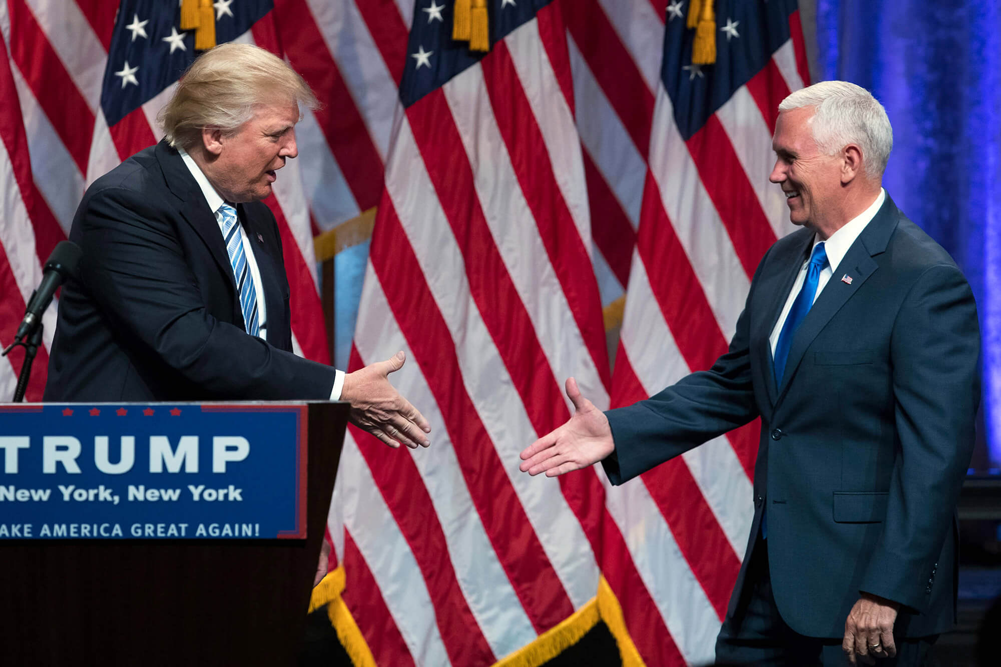 Image of Trump about to Shake Pence's hand.