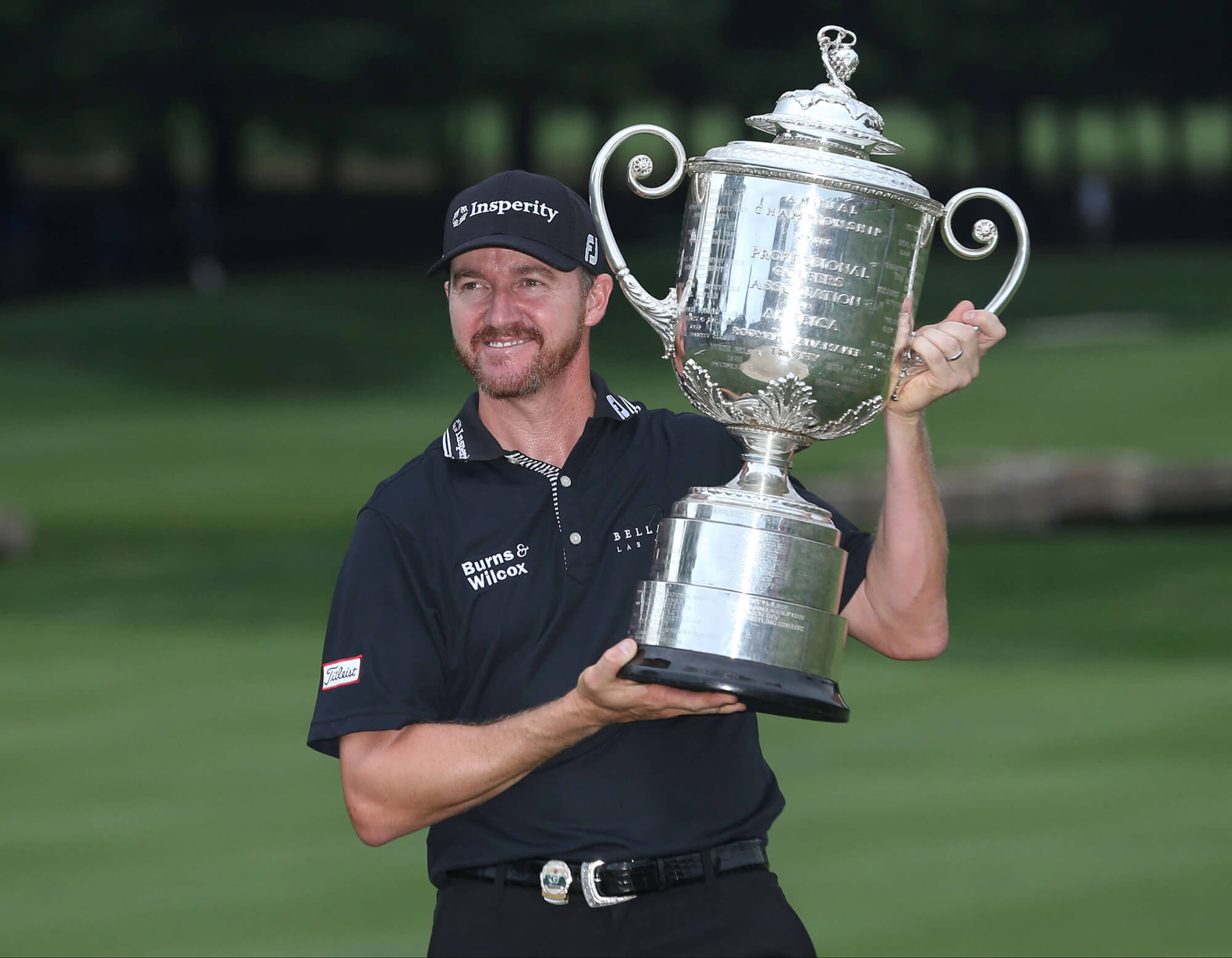 Image of Jimmy Walker with the trophy from PGA major.