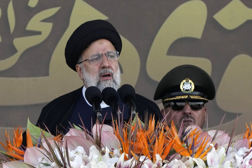 ranian President Ebrahim Raisi speaks during an annual military parade marking anniversary of the beginning of war against Iran by former Iraqi Dictator Saddam Hussein, in front of the shrine of the late revolutionary founder Ayatollah Khomeini, just outside Tehran, Iran, Friday, Sept. 22, 2023.