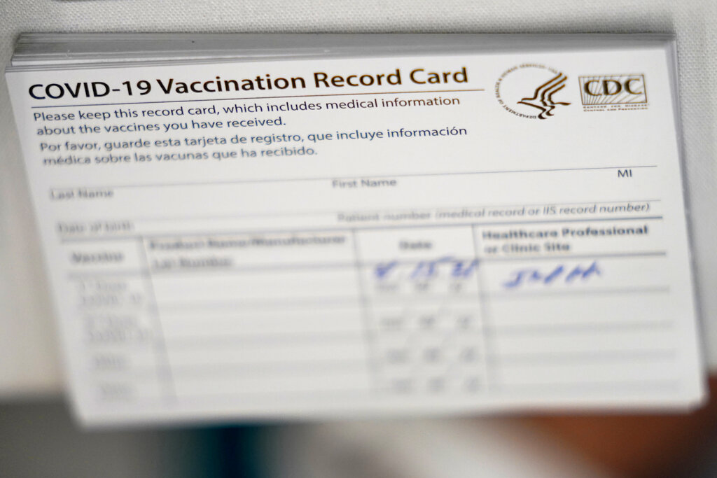 CDC coronavirus COVID-19 vaccination cards are shown at the Christine E. Lynn Rehabilitation Center at Jackson Memorial hospital, April 15, 2021, in Miami