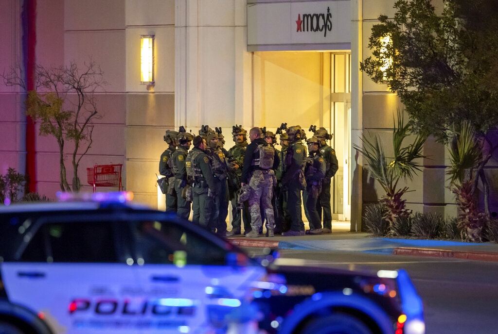 Police officers gather at an entrance of a shopping mall, Wednesday, Feb. 15, 2023, in El Paso, Texas