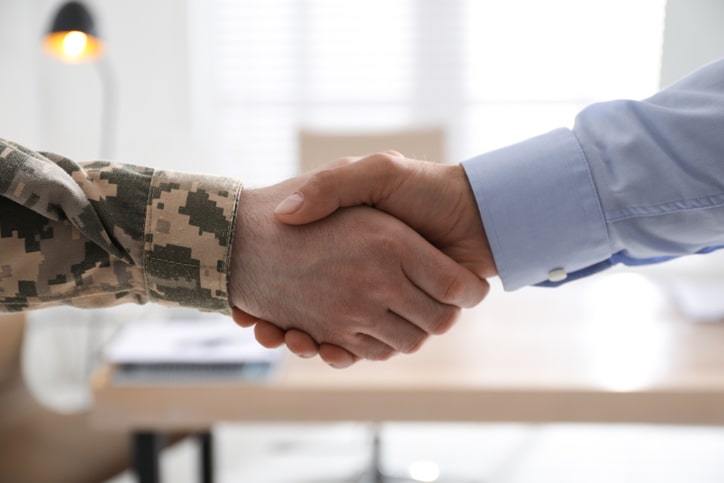 Military and civilian handshake