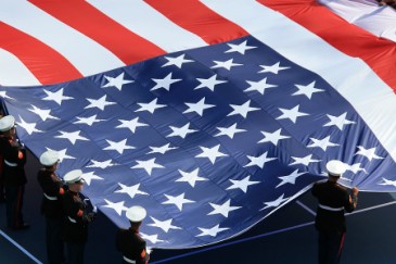 U.S. troops holding American Flag