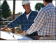 Foreman and Surveyor at Construction Site