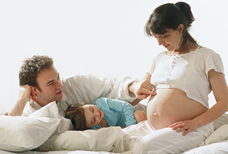 Pregnant woman with family
