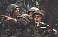 Close Up of Soldiers, One Pointing