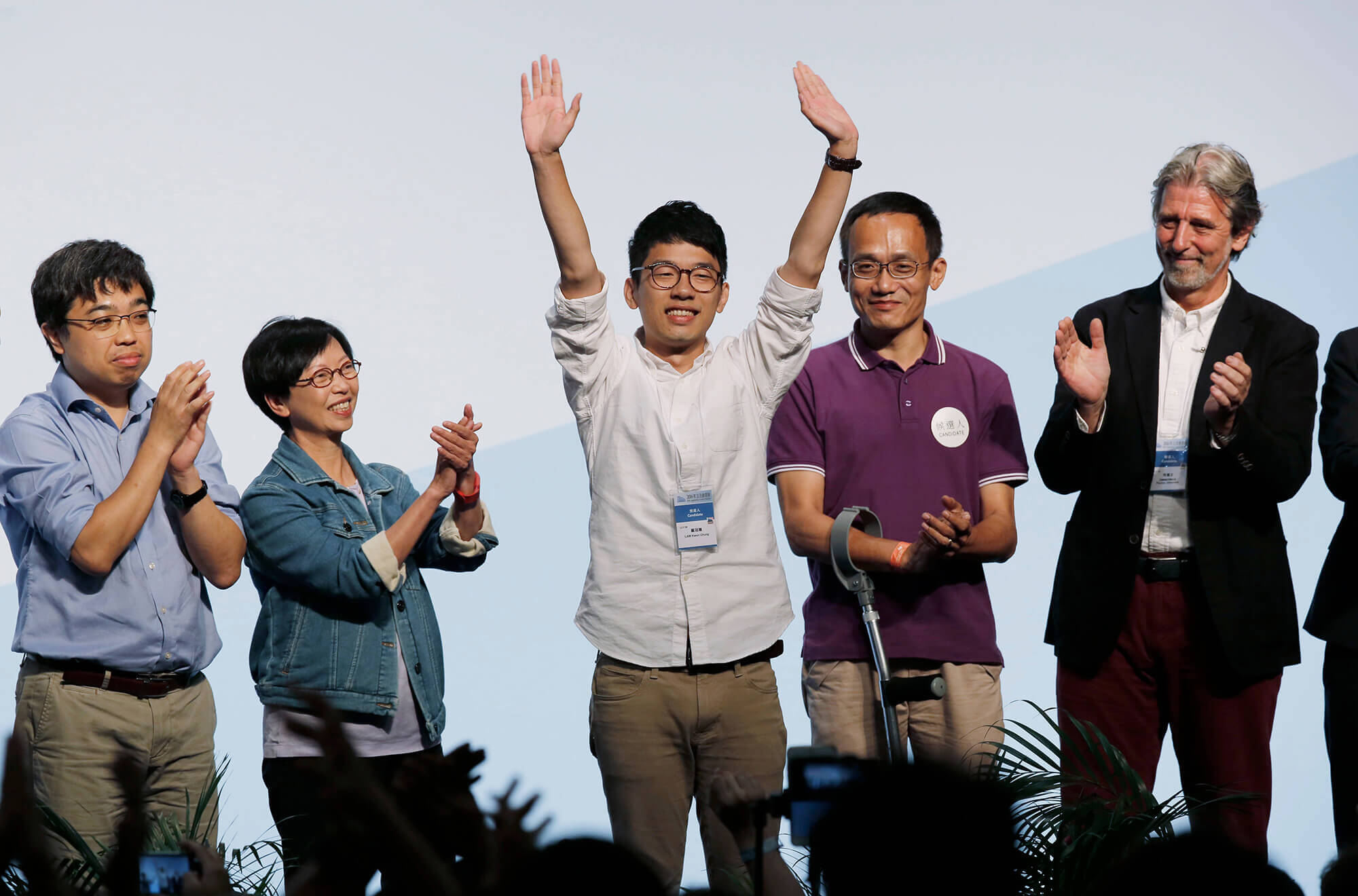 Image of Nathan Law, an anti-China activist celebrating after winning a legislative seat.