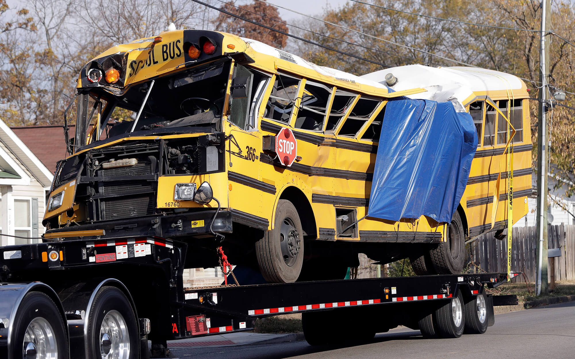 Image of school bus on tow truck