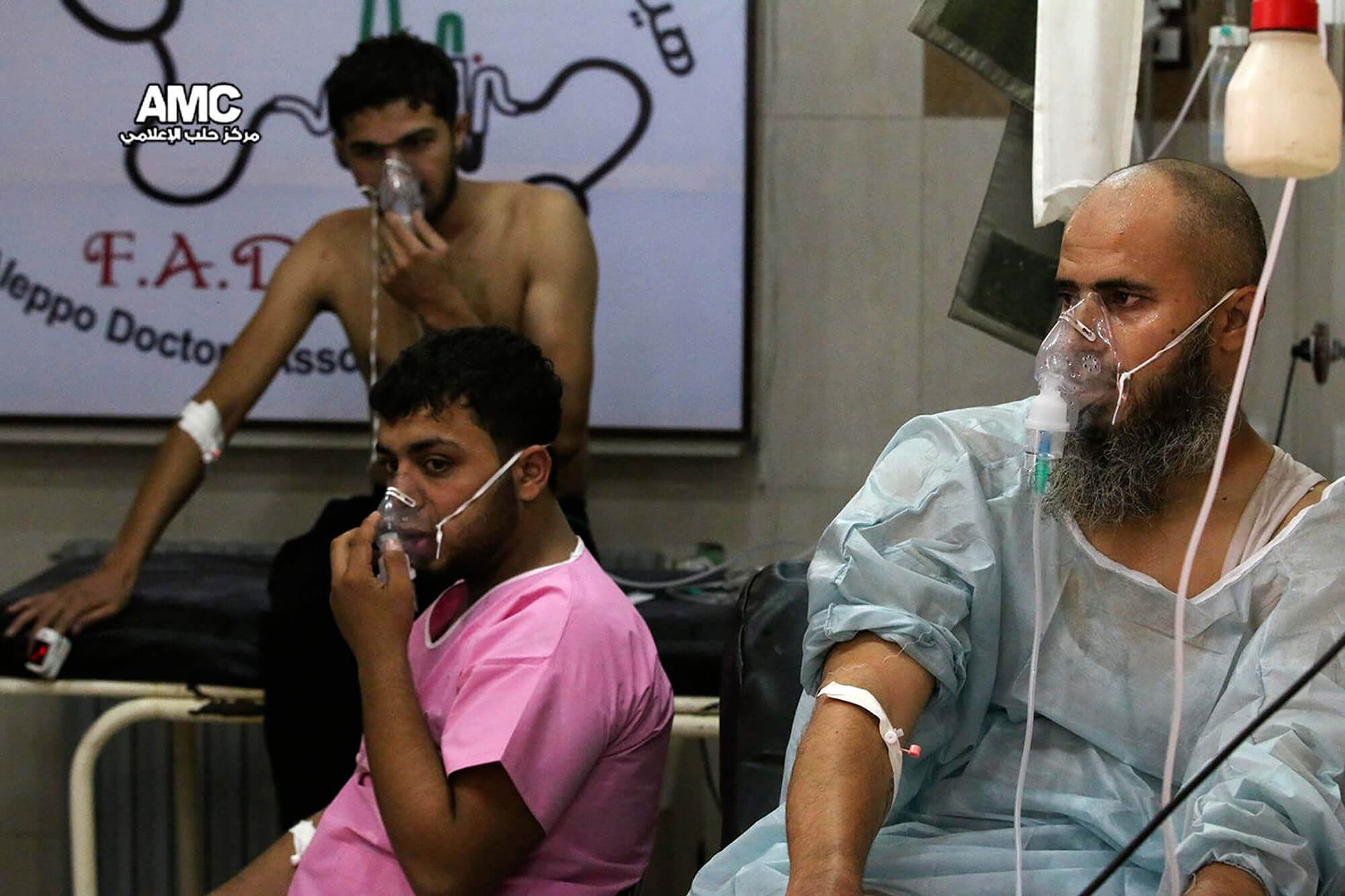 Image of civilians with oxygen masks.