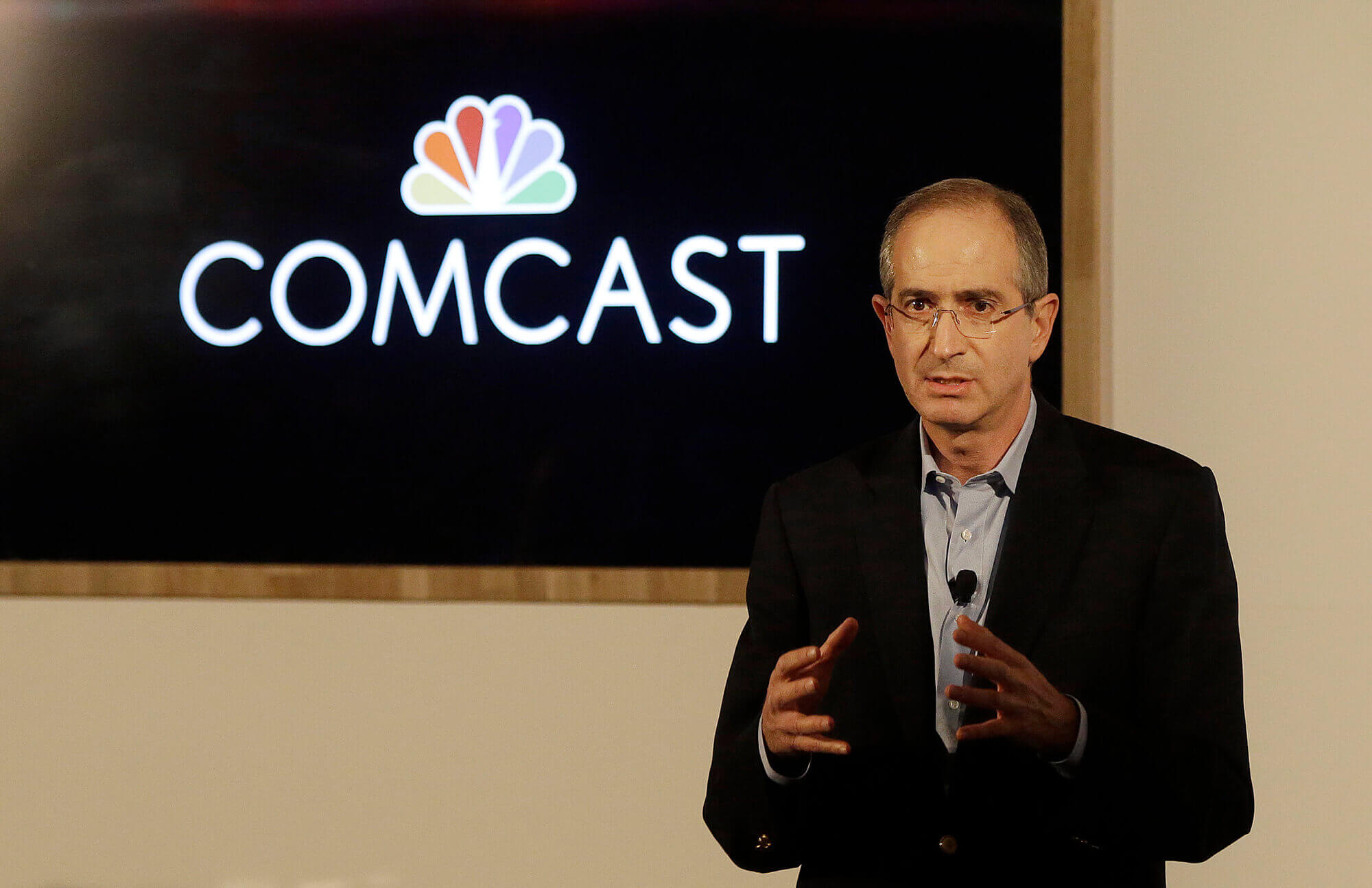 Image of CEO with Comcast logo