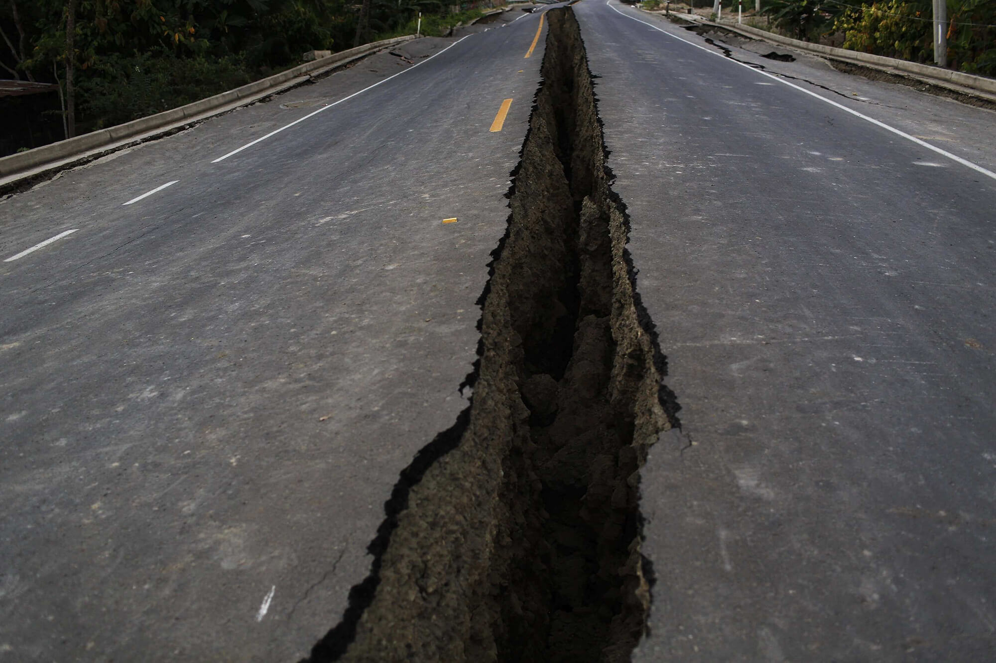 photo shows a rift in the highway caused by a 7.8-magnitude earthquake in ecuador