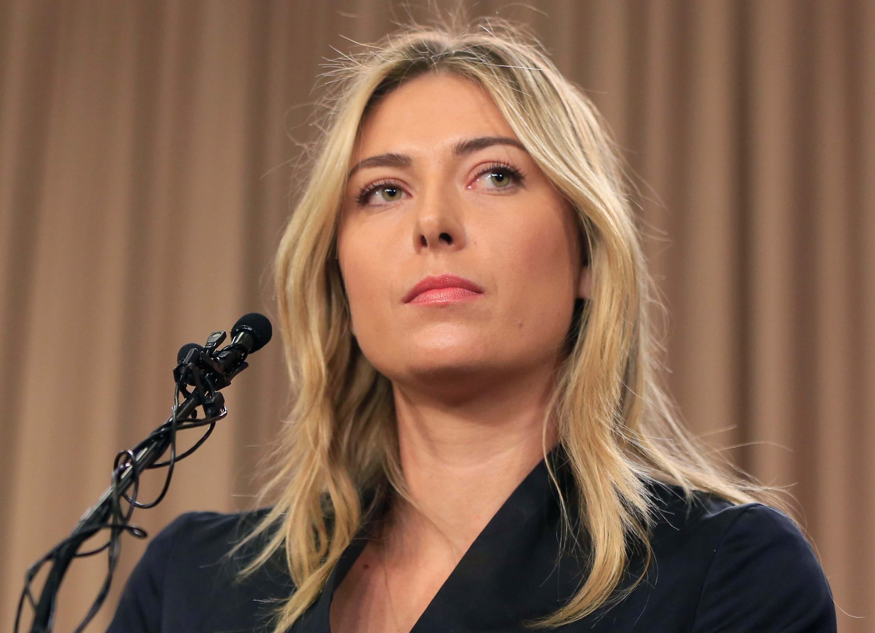 photo showing tennis star Maria Sharapova speaking about her failed drug test