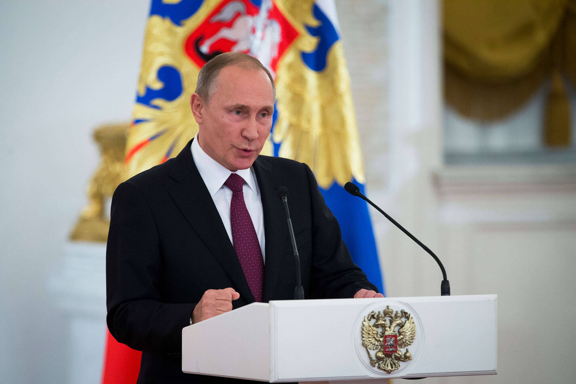 Image of Putin speaking at a conference