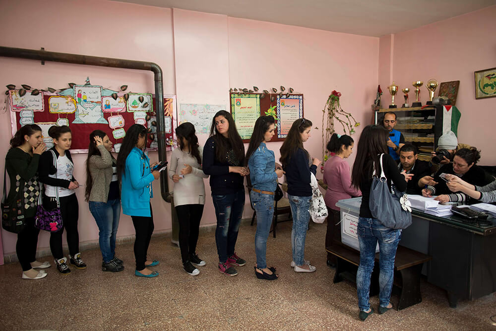 syrian women waiting to vote in parliamentary elections