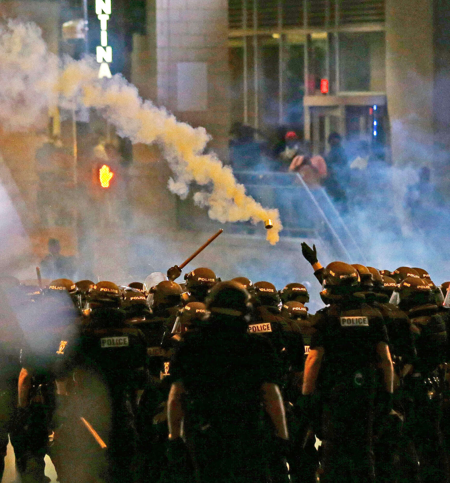 Image of police tear gassing protesters