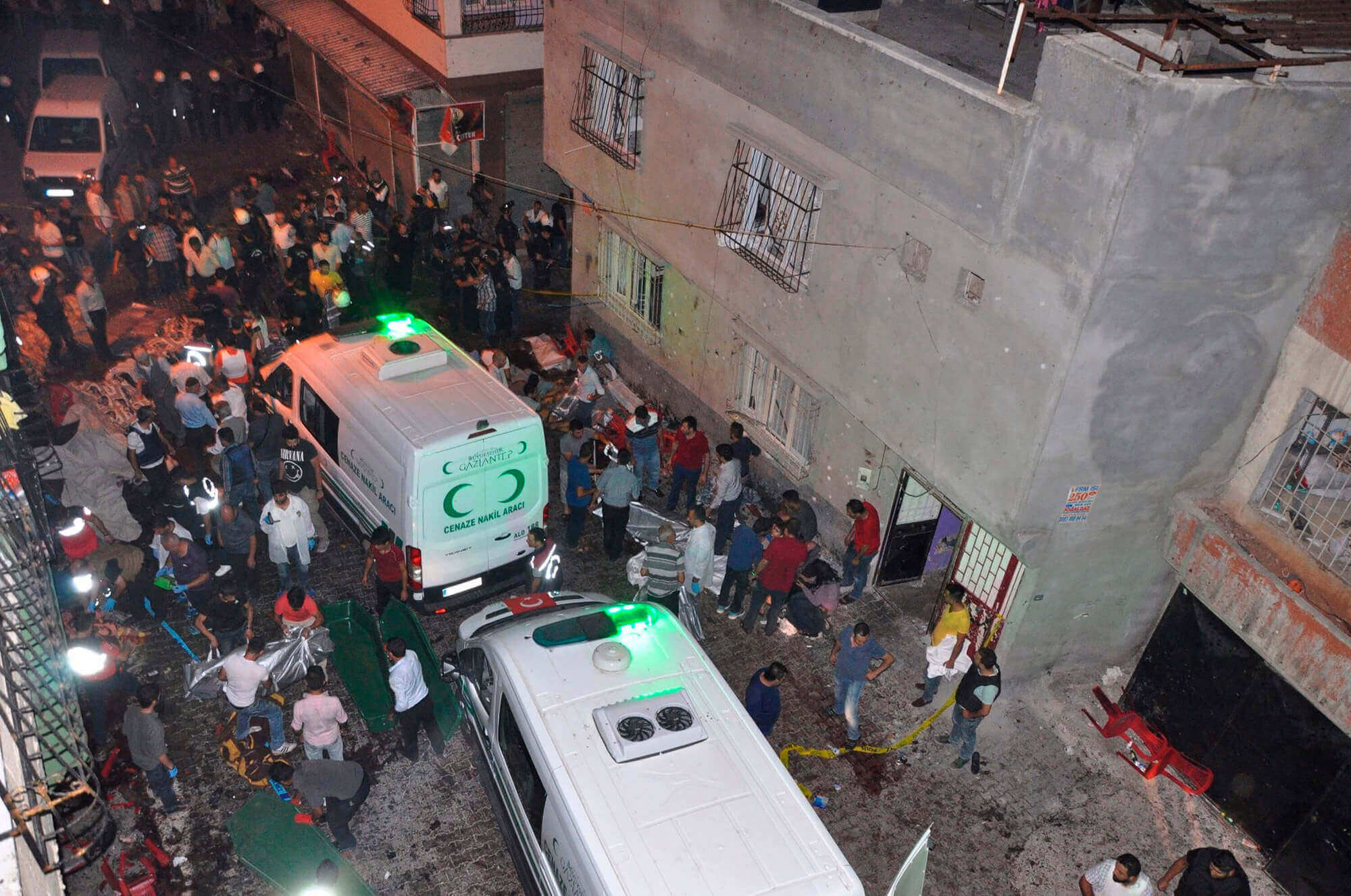 Image of people carrying dead bodies into ambulance after explosion at wedding in Turkey