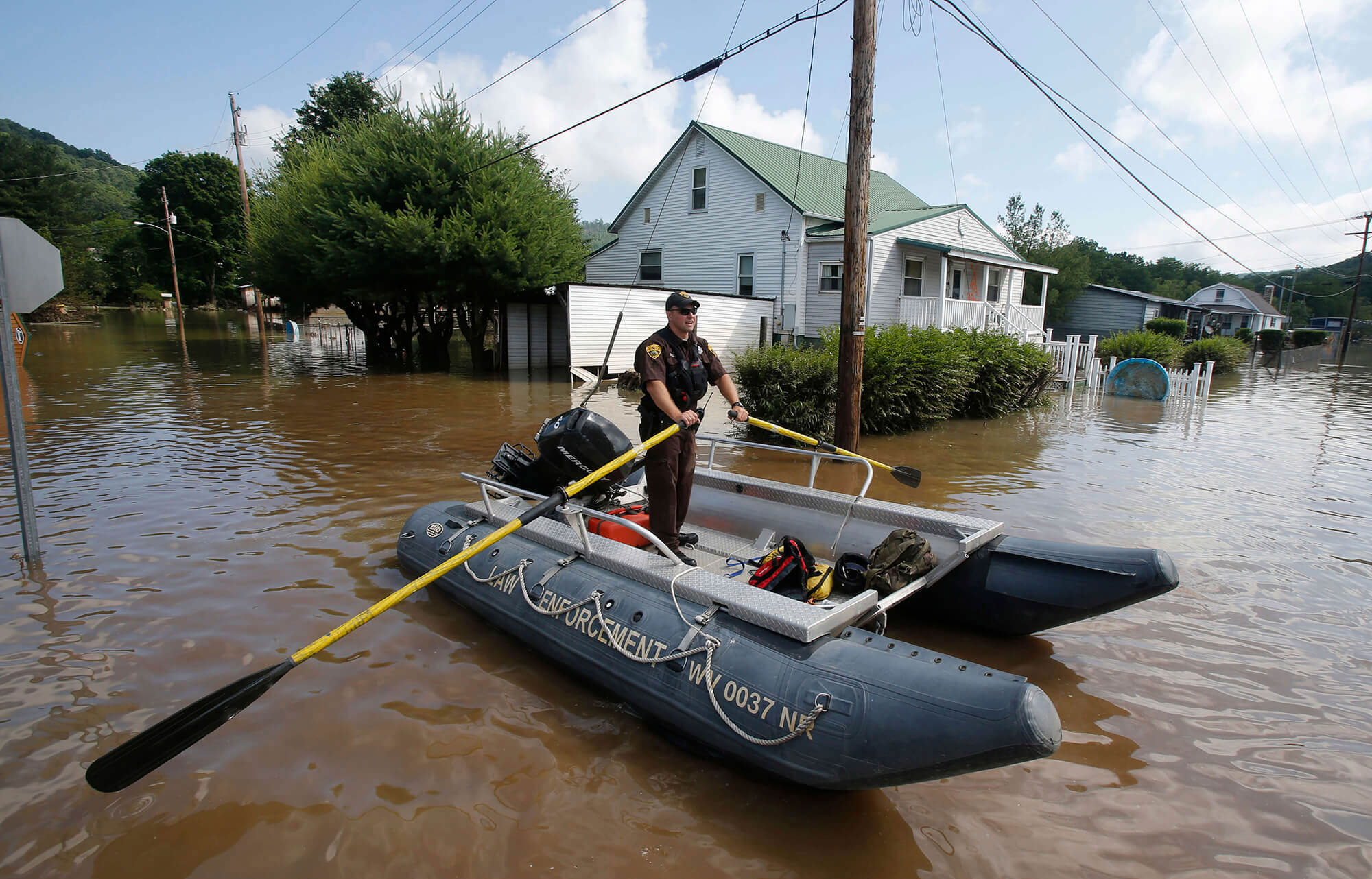 Image of West Virginia National Guard seaching homes in floods