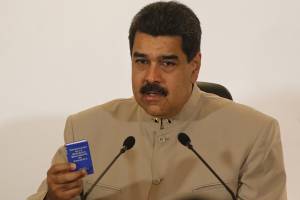 Maduro Holds a Copy of the Constitution