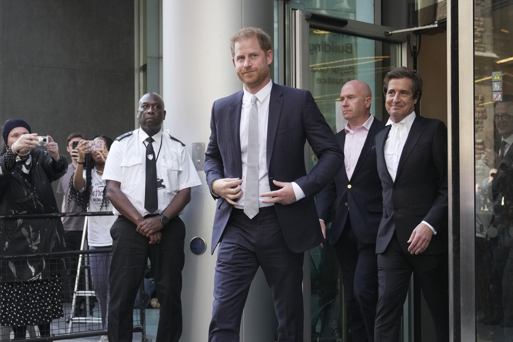 Prince Harry, left, and David Sherborne, Prince Harry's lead lawyer, right, leave the High Court after giving evidence in London, Wednesday, June 7, 2023. 