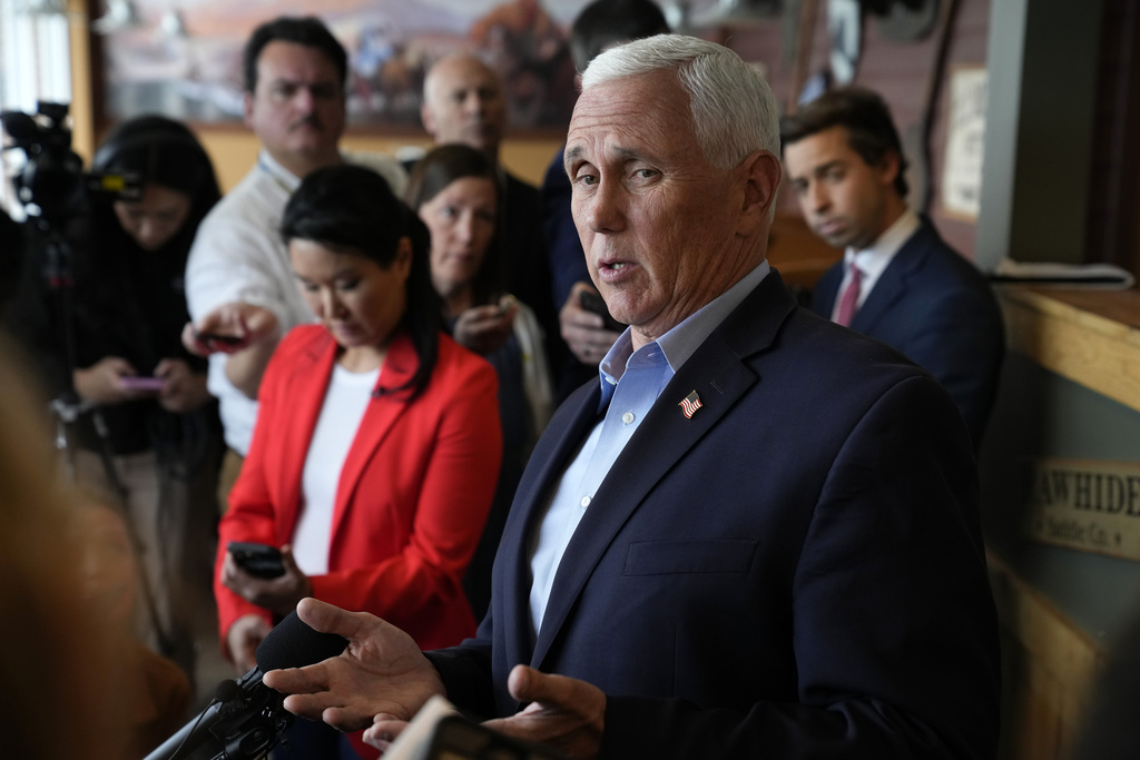 Republican presidential candidate former Vice President Mike Pence speaks to reporters during a stop at the Pizza Ranch, Thursday, June 8, 2023, in Waukee, Iowa.