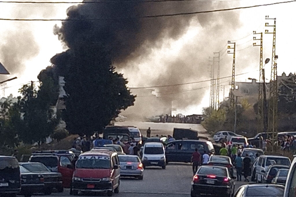 Black smoke rises from the scene where a fuel tanker exploded.