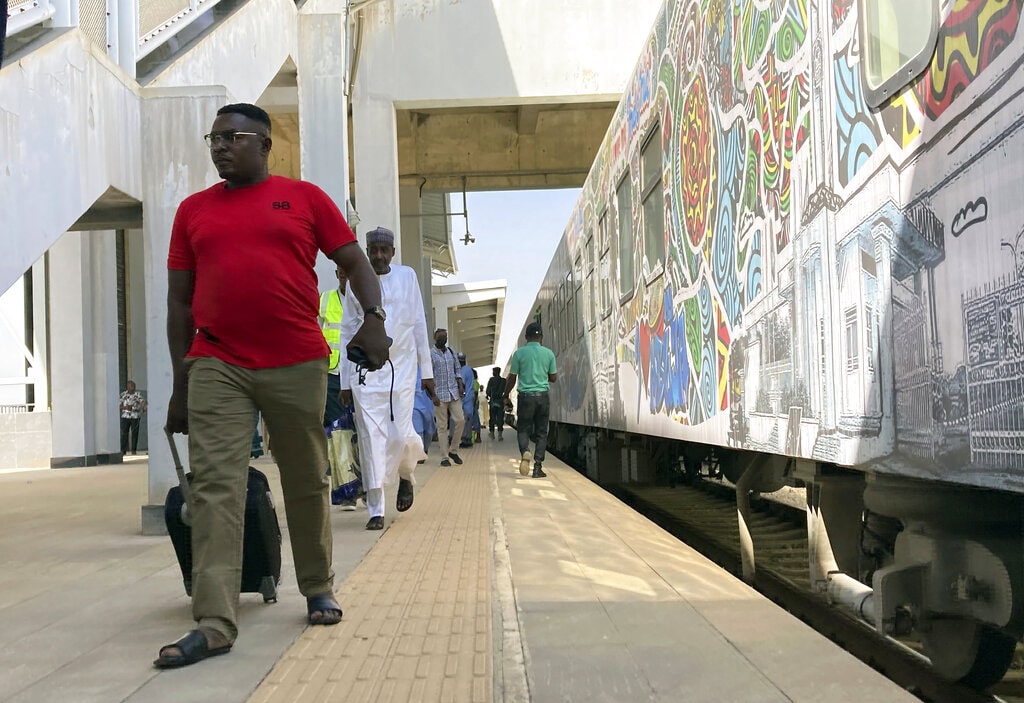 Passengers disembark from a train at a train station in Nigeria