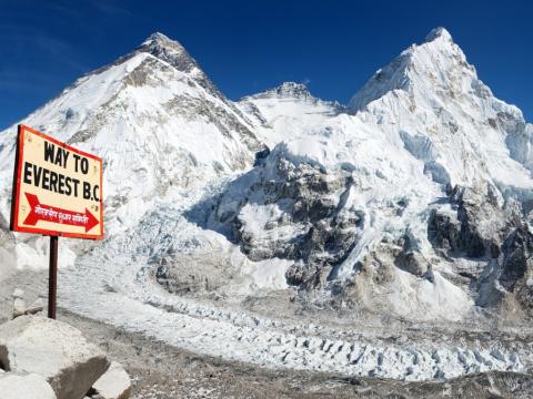 Mount Everest with sign to base camp