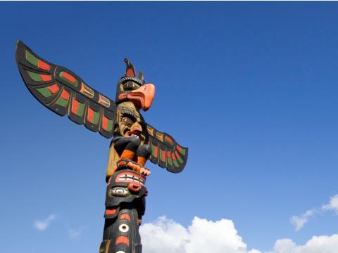 Totem pole against a blue sky
