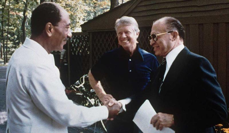 In a ceremony at the White House, President Sadat of Egypt and Prime Minister Begin of Israel signed