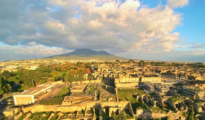 Mount Vesuvius erupted and buried the towns of Pompeii and Herculaneum.