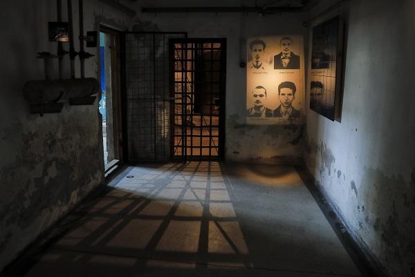 Portraits of Romanian torture victims projected in their old prison.